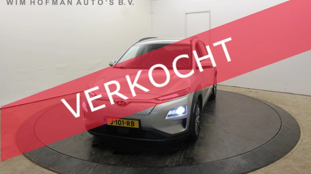 Hyundai Kona EV Premium 64 kWh Warmtepomp Trekhaak SOH 100% 3-Fase CCS Laden Leder Camera — foto 1
