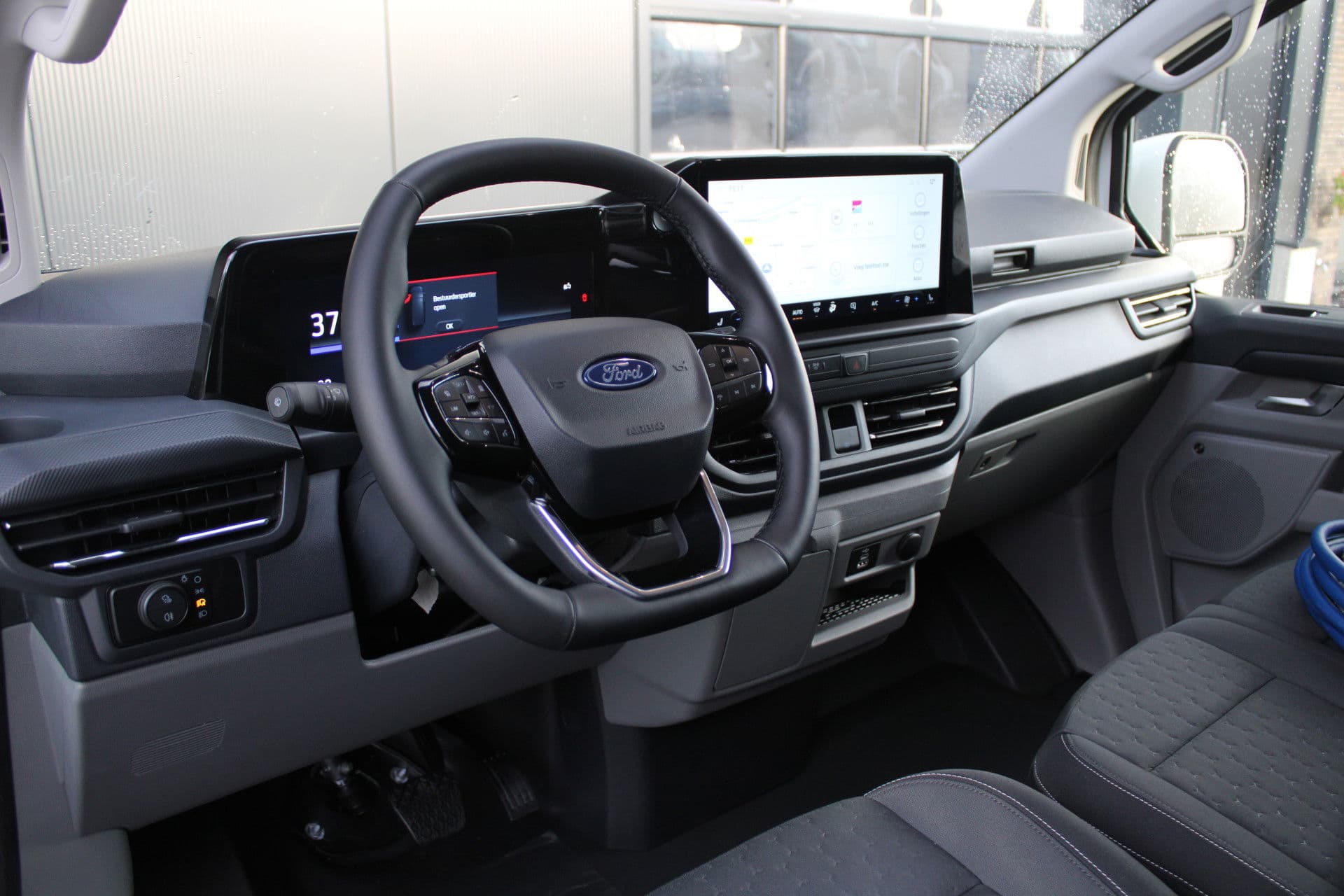 Ford E-Transit Custom 340 L2H1 Limited 65 kWh 218pk - 2x Schuif - LED - 360 Camera - B&O - ACC - Navi - Stoel/Stuurverwarming - Rijklaar thumbnail 2